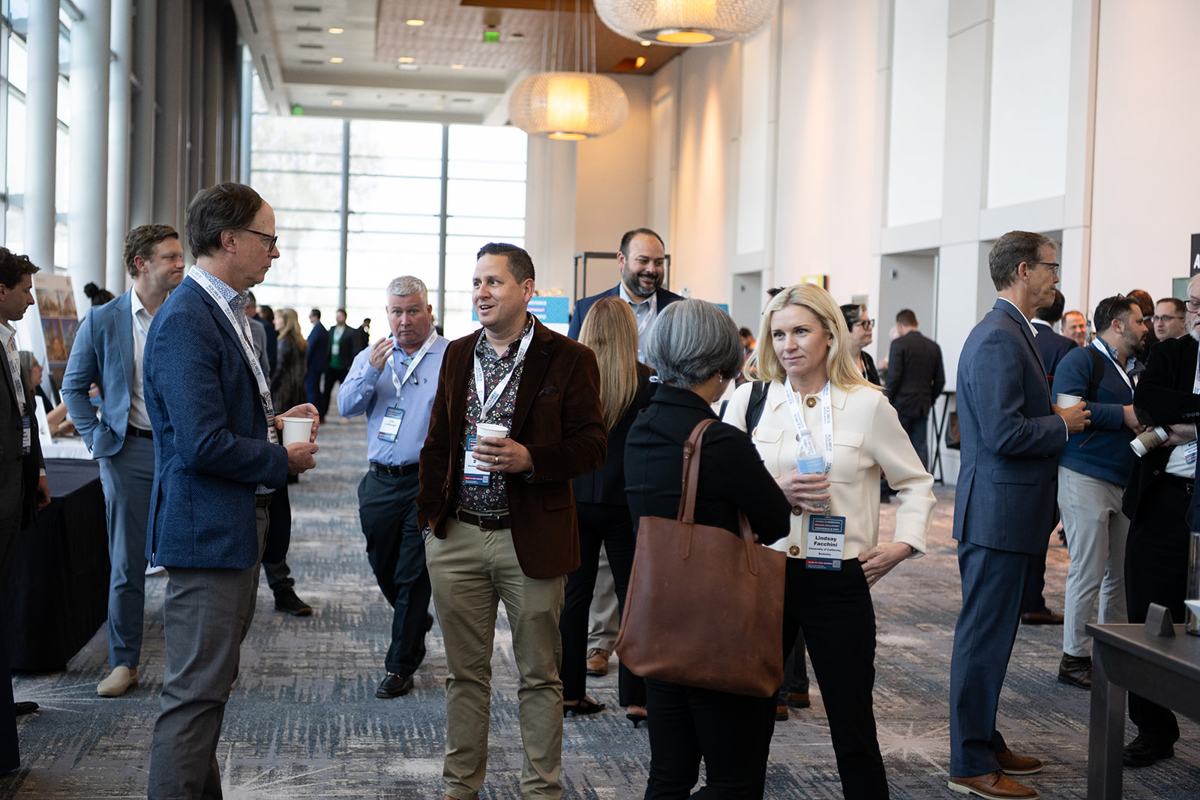 Attendees networking in a crowded concourse