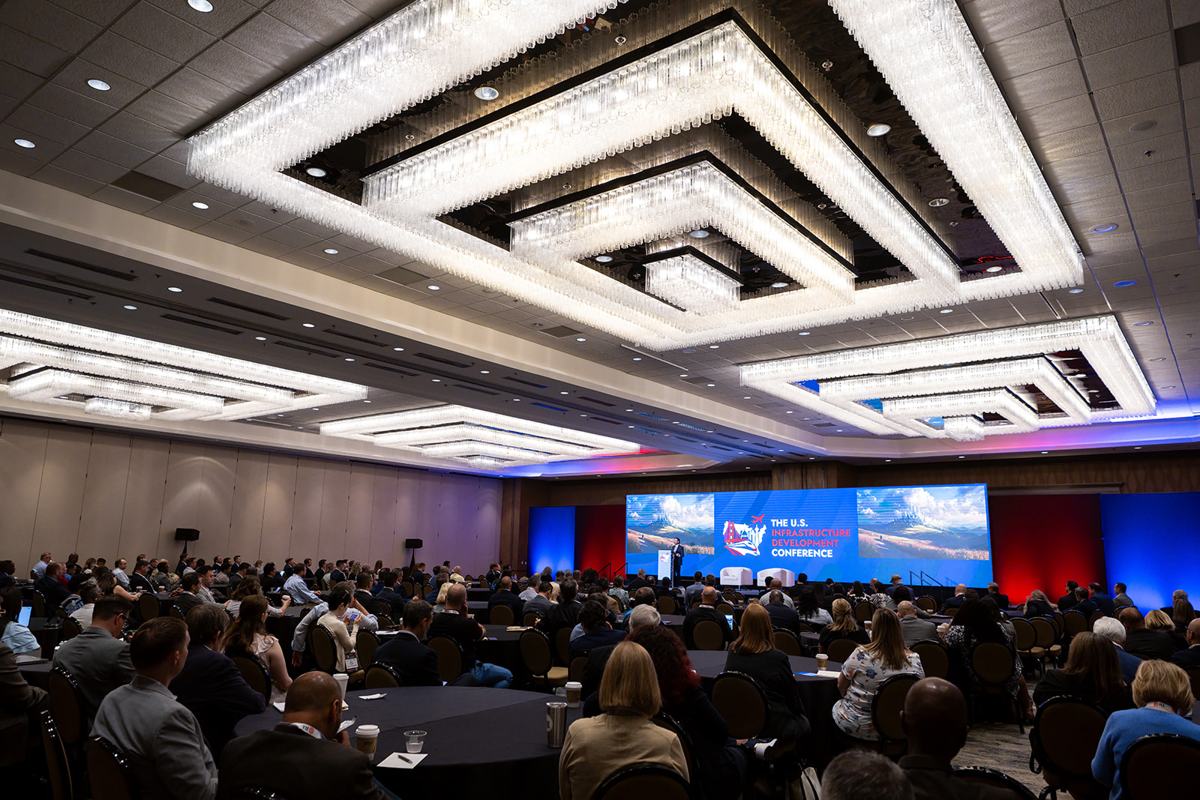 A full ballroom facing the main stage
